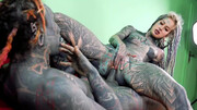 Inked slut shoves monster dick in each of her holes