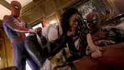 Two superhero hunks are having their way with a black babe