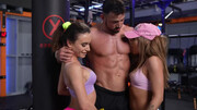 Gym threesome with a hunky lad and a duo of horny babes