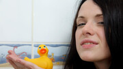 Thirsty teen spreads her pussy lips next to a rubber duck