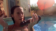 Sofie Marie is swimming in the pool and uses her toy