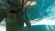 Diving in the pool and playing with a big dildo in HD